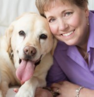 Robin Bennett and her dog smiling