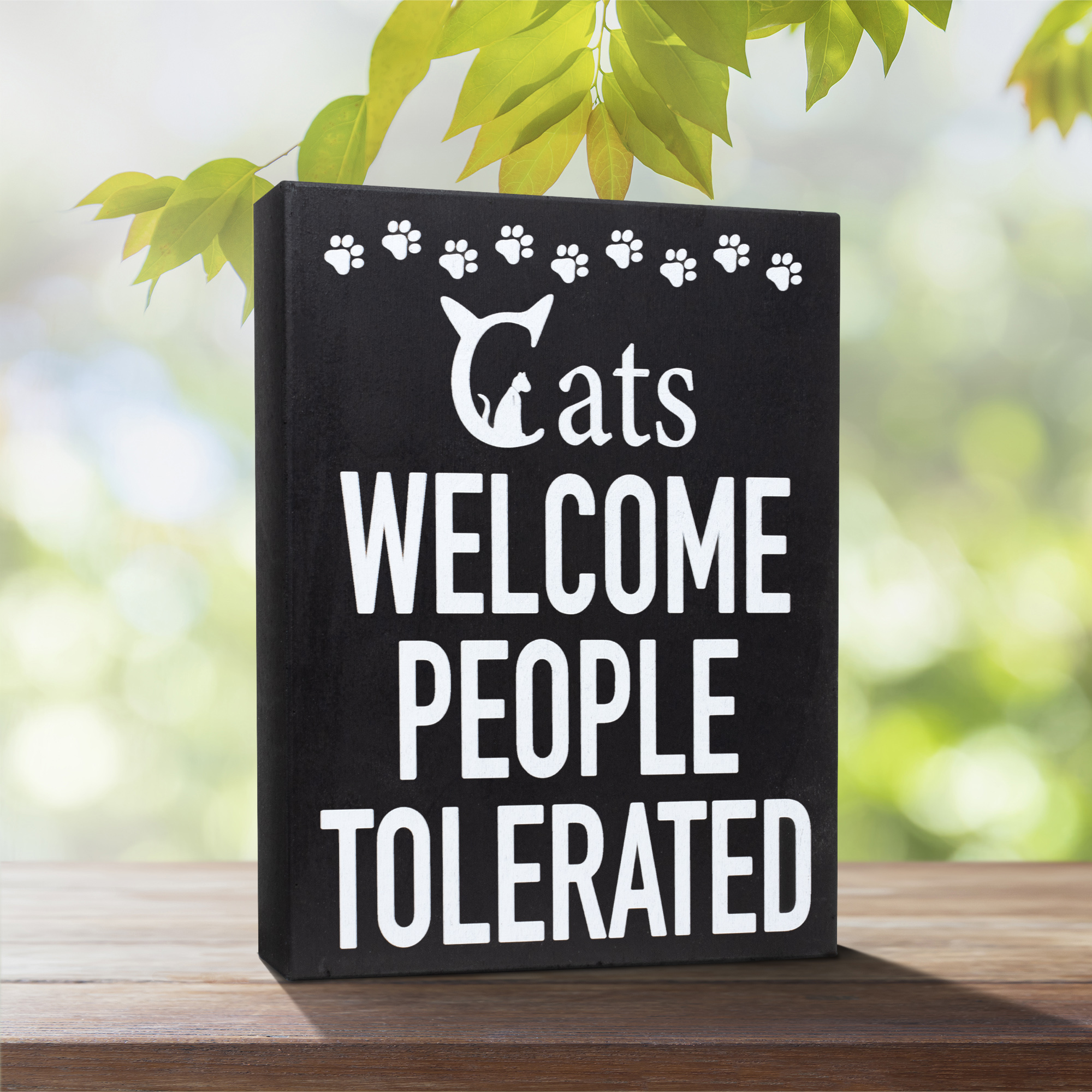 decorative sign saying "Cats welcome, people tolerated"